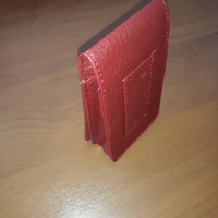 Porta pacchetti con asola per cintura rosso pelle