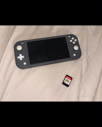 Nintendo switch lite insieme a gioco kirby