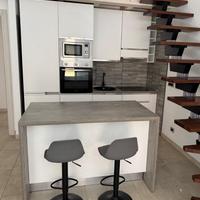 Cucina lineare + isola + sgabelli