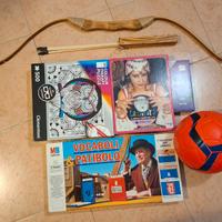 Giochi in scatola, arco e pallone