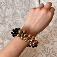 Bracciale con perle nere e oro