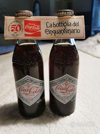 CocaCola coppia bottiglie Cinquantenario 1927/1977