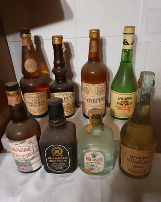 8 bottiglie grappa da collezione 