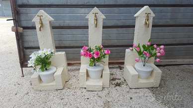 Fontane in pietra con fioriere