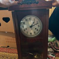 Orologio con pendolo in legno