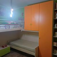 Camera da letto con soppalco