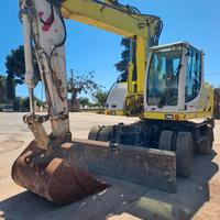 Escavatore gommato New holland 165