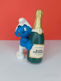 20708 Puffo con bottiglia di champagne