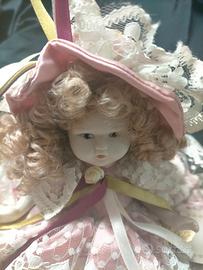 ANTICA BAMBOLA IN PORCELLANA CM.25