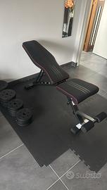 Panca con pesi regolabili e tappeto