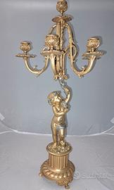 Coppia candelabri in bronzo dorato.