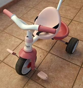 Triciclo Smoby rosa con canna parentale