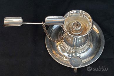 Antico accendisigaro in metallo con spegni fiamma