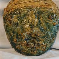 Maschera in terracotta dipinta
