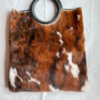 Borsa in pelle e cow naturale a mano e a tracolla