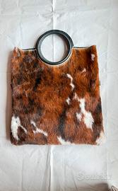 Borsa in pelle e cow naturale a mano e a tracolla