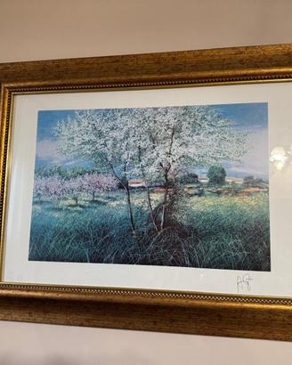 Quadro con paesaggio fiorito e cornice dorata