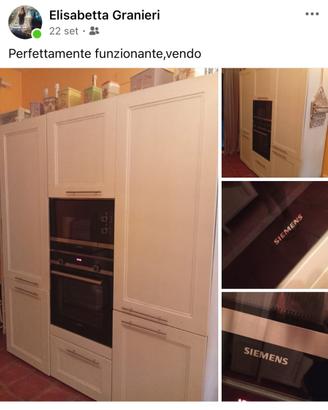Credenza con elettrodomestici e cucina completa