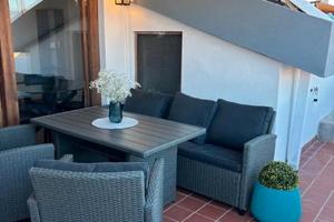 Luminosa mansarda arredata con terrazza