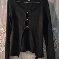 maglia nera vintage con bordi ondulati 