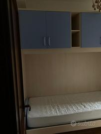 Camera con armadio a ponte