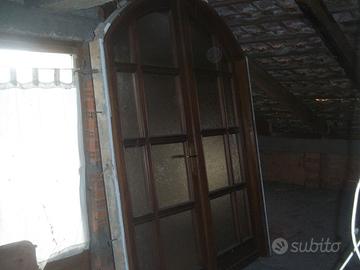 Porta a due ante  in noce nazionale