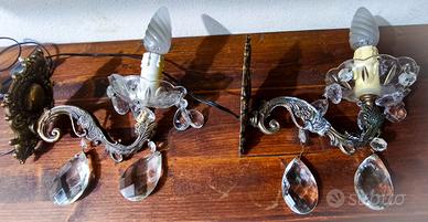 Appliques in ottone e cristalli.