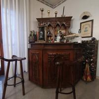 Soggiorno, angolo bar e camera da letto