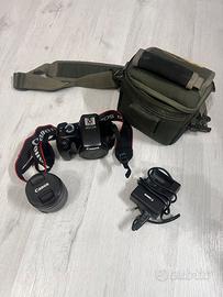 Canon EOS 1100D + obiettivo 18-55mm + caricabatter