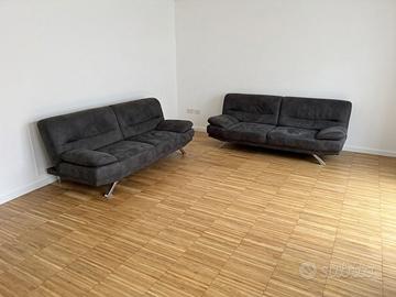 Coppia di divani in tessuto grigio antracite