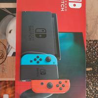 nintendo switch completa di accessori e due giochi