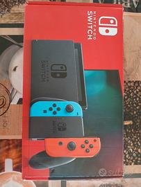 nintendo switch completa di accessori e due giochi