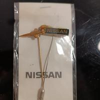 Spilla F104S e Spilla Nissan d'epoca