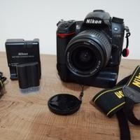 Nikon D7000 + battery grip + 2 batt. 29.664 click