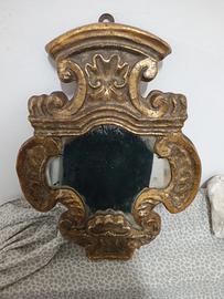 Antica specchiera in legno intagliato