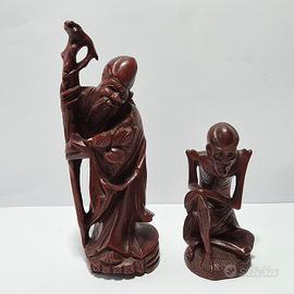 Coppia di sculture cinesi di saggi in legno 