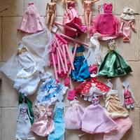 3 Barbie e molti vestiti