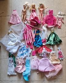 3 Barbie e molti vestiti