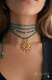 Choker scamosciato verde acqua  con ciondolo sole