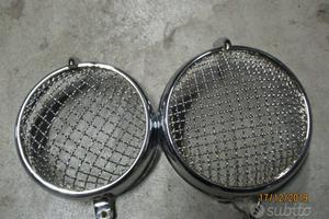 Cornici faro con griglia + ricambi vari moto