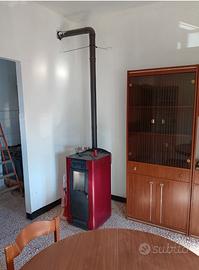 Appartamento con box auto e piccolo terreno orto