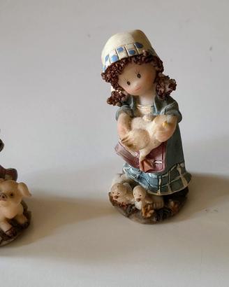 Tre statuine bamboline vintage 