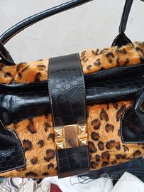 camomilla borsa in pelle pelliccia e borchie in or