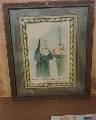 Antichissimo quadro con cornice in legno.