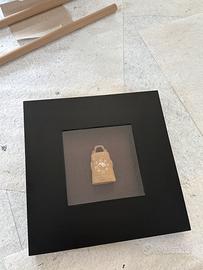 Coppia di quadri con teca e bassorilievo orientale