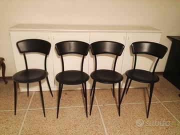 4 sedie in pelle e metallo.