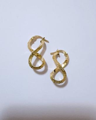 Orecchini infinito con numeri romani oro 18kt 750