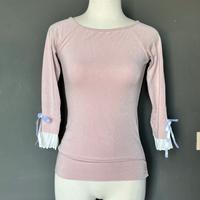 Maglia rosa con maniche plissettate