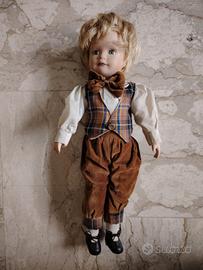 Bambola con viso e arti in porcellana 