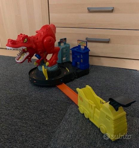 Hot Wheels City - Mega Dino Trasportatore, pista da corsa che si trasforma in un T-Rex & Confezione da 20 Macchinine, Veicoli in Scala 1:64 Assortiti